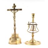 A 19th Century brass tavern candlestick, 28cm high together with a brass alter crucifix 39cm