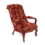 A Victorian mahogany button backed armchair.