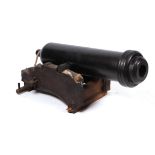 A large ornamental garden cannon having a metal barrel with wooden plug 83cms (32.75ins) long