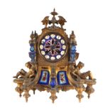A late 19th century French mantle clock, having a blue porcelain dial with Roman numerals, fitted an