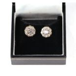 A pair of 9ct gold cluster stud earrings set with white stones.