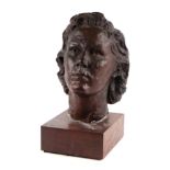 A bronzed plaster bust of a lady in the manner of Jacob Epstein, mounted on a wooden plinth, 34cm
