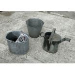 A galvanised bucket, a galvanised mop bucket together with a water can. (3)