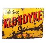 An original enamel advertising sign 'Smoke Klondyke Cigarettes', 102 by 76cms. Condition Report