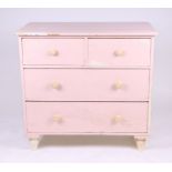 A painted pine chest of two short and two graduated long drawers, on turned feet, 91cms wide.