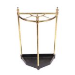 A lacquered brass four-division stick stand, 39cms wide.