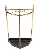 A lacquered brass four-division stick stand, 39cms wide.