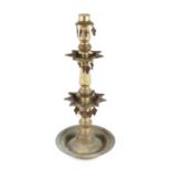 An Islamic brass stand, 60cms high.