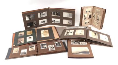 Seven albums of black & white photographs including topographical, seascapes and family portraits.