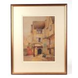 Early 20th century British school - Courtyard Scene with a Figure in the Foreground - watercolour,