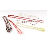 A group of vintage costume bead necklaces to include a graduated bead uranium glass necklace.