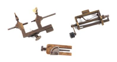 Three antique antique watch maker's tools including a spring winder (3).