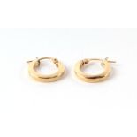 A pair of 18ct gold hoop earrings, 1.5g. Condition Report Both in good condition