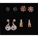 Four pairs of 9ct gold gem set dress earrings.