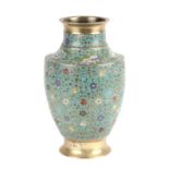 A Japanese brass cloisonne vase decorated with flowers on a blue ground, 30cms high.