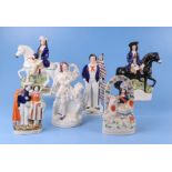 A group of 19th century Staffordshire pottery figures to include Dick Turpin, the largest 23cms high