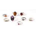 A group of silver gem set dress rings (8) 28.5g.