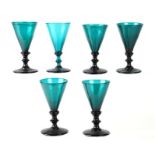 A harlequin set of six Bristol green wine glasses with knopped stems and snapped of pontil marks.