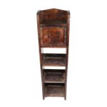 A carved four-tier bookcase in the Japanese taste, 31cms high.