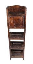 A carved four-tier bookcase in the Japanese taste, 31cms high.