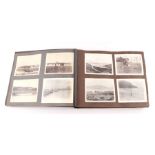 An early 20th century photo album containing World Tour and Military photos; together with a