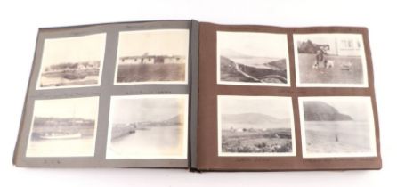 An early 20th century photo album containing World Tour and Military photos; together with a