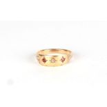 A 9ct gold diamond and ruby gypsy style ring, approx UK size L, 2.2g (marks rubbed).