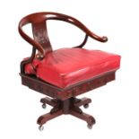 A Chinese hardwood revolving desk chair.
