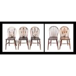 A set of four wheelback kitchen chairs; together with a similar stick back kitchen chair (5).