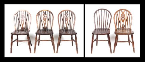 A set of four wheelback kitchen chairs; together with a similar stick back kitchen chair (5).