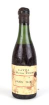 A half bottle of Caves de la Maison Prunier, Anjou 1928.