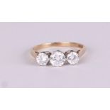 A 9ct gold three-stone cubic zirconia ring, approx UK size R, 2.8g.