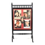A Victorian Aesthetic ebonised fire screen with inset stylised print depicting the trials of