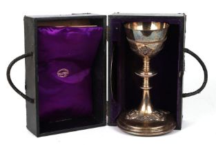 A large silver chalice with knopped stem and ruby coloured cabochons, 23cms high, with matching