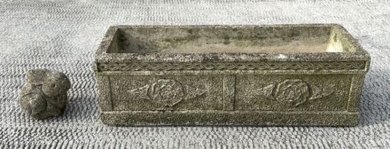 A reconstituted stone rectangular planter, 61cms wide.