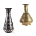 An Indian bidri style vase of tapering and flared cylindrical form, 26cms high and another brass