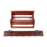 A pine wall mounted plate rack, 76cms wide; together with a walnut plate shelf, 120cms wide (2).