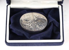 A modern silver Victorian style two-division snuff box with engraved decoration, 18g, cased.