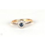An 18ct gold diamond and sapphire cluster ring, approx UK size P, 2.7g.
