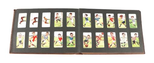 An album of cigarette cards including John Player & Sons Cricketers 1934, Football, Rugby, Actors