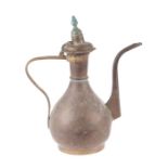 An Turkish / Islamic brass coffee pot, 33cms high.