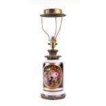 An early 20th century brass mounted porcelain table lamp decorated with flowers, 27cms high