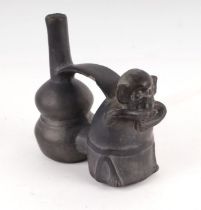 Antiquity. A Peruvian pottery vessel in the form of a double gourd and a monkey, circa 1000-1470