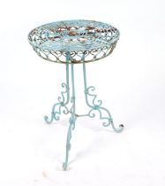 A painted wirework conservatory or garden table, the circular top on a triform base, 44cms