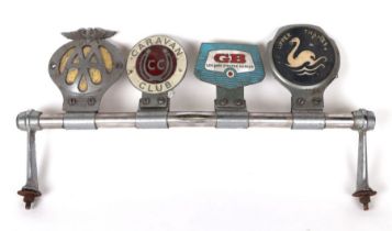 A chrome plated badge bar with four badges to include AA and Caravan Club.