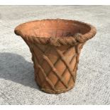 A large Victorian terracotta planter with basket weave decoration, 43cms diameter.