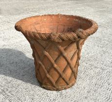 A large Victorian terracotta planter with basket weave decoration, 43cms diameter.