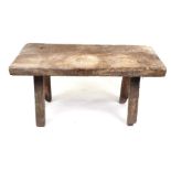 A late 19th century pig bench, the rectangular top on stout rectangular legs, 102cms wide.