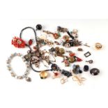 A quantity of costume jewellery to include a stick coral brooch; a pair of coral drop earrings,