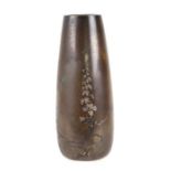 A Japanese mixed metal tapering cylindrical vase decorated with flowers and foliage, 12cms high.